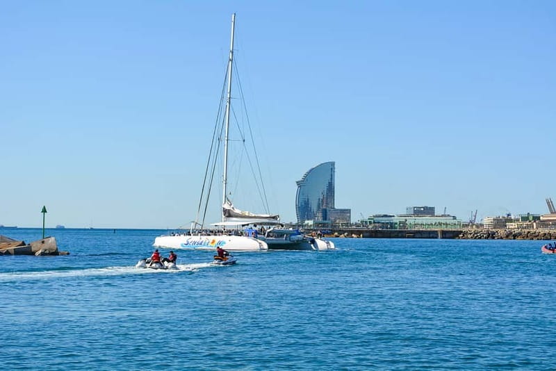 Barcelona: Catamaran Party Cruise with BBQ Meal - Music and dance energy: fun for most, too loud for some