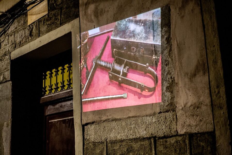 Barcelona: Dark History Night Walking Tour - How the wall projector and headsets change the experience