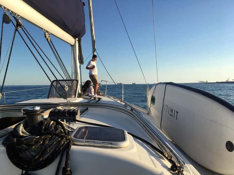 Barcelona: Daytime or Sunset Cruise with Drinks - Boarding, Safety, and the Welcome Drink Setup