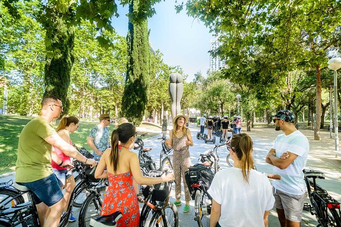 Barcelona E-Bike Small Group Tour with Tapas & Wine Tasting - Riding toward Barceloneta, Port Olímpic, and Port Vell