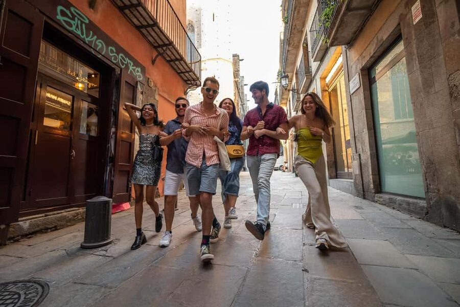 Barcelona: Gothic Quarter Walking Tour with 10+ Attractions - Entering The Gothic Quarter, Starting at Plaça del Vuit de Març