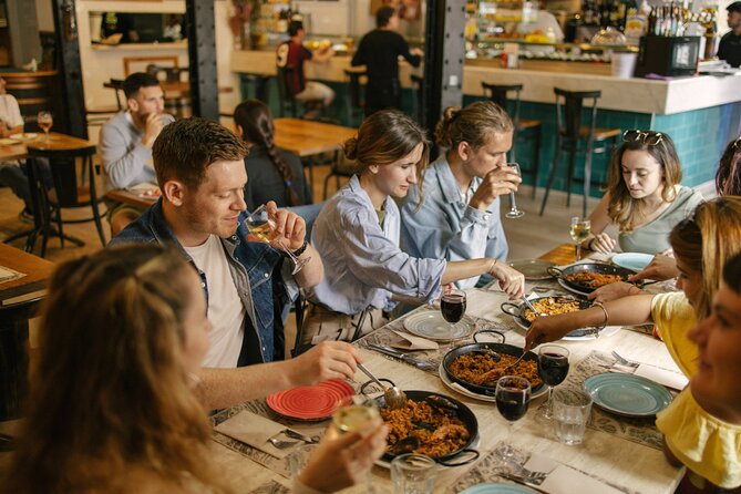 Barcelona: Guided Food Walking Tour with Tapas and Wine - Roman Walls and Walk-Only Moments: Baixada de Viladecols Through Time