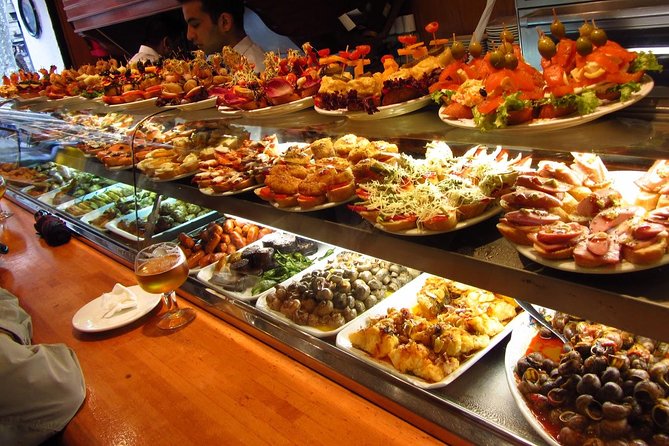 Barcelona Old Town Night Small Group Tour with Tapas & Flamenco - Las Ramblas at night, plus tapas and your one included drink