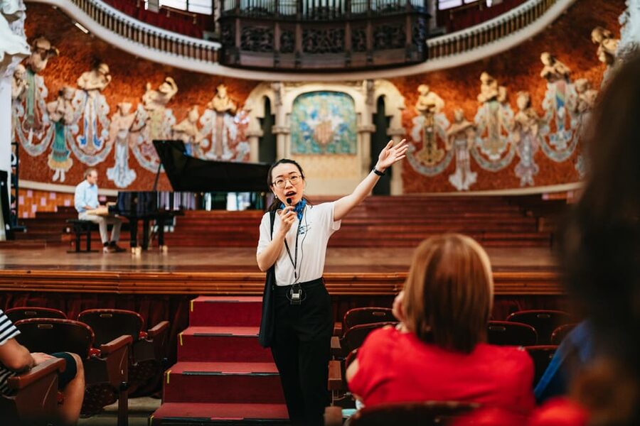 Barcelona: Palau de la Música Guided Tour - The grand staircase: floral design, flags, and the best pause points