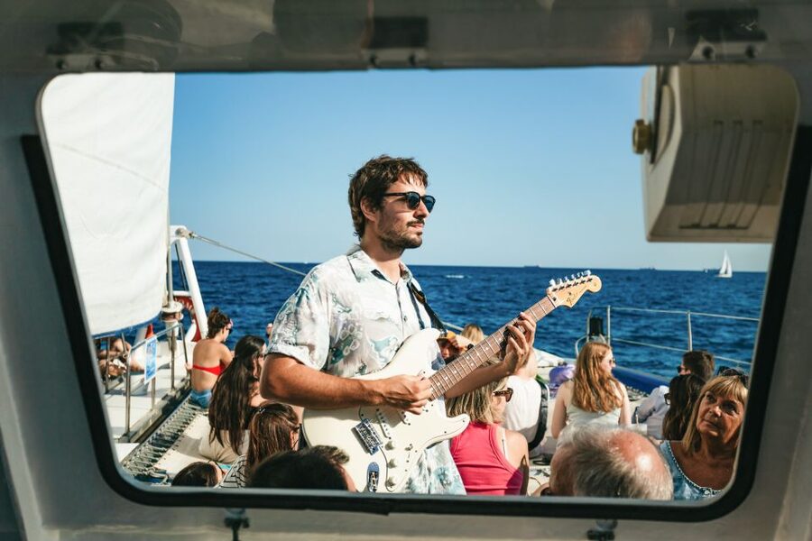 Barcelona: Sunset Catamaran Cruise with Live Music - Views over Barcelona: skyline, beaches, and photo moments