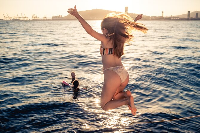 Barcelona Sunset Cruise with Light Snacks and Open Bar - Sailing Into Sunset: Golden Views From the Water
