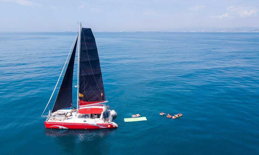 Barcelona: Sunset or Day Catamaran Cruise with Tapa & Drink - Marina Vela: your easy jump-off by Barceloneta