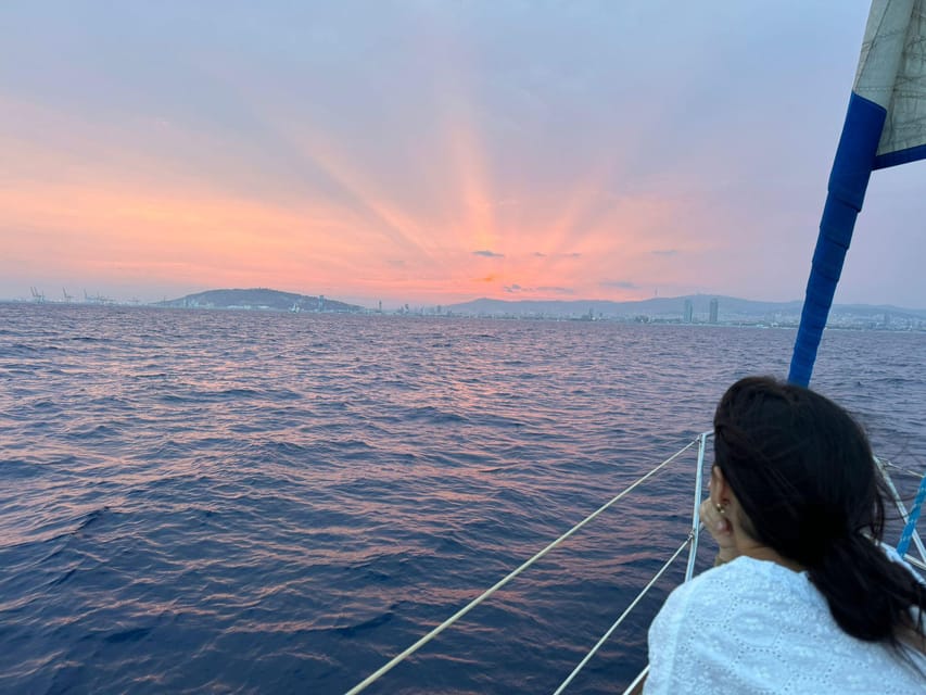 Barcelona: Sunset Sailboat Cruise with Drinks and Snacks - The views: Sagrada Familia, Montjuïc, and the coastline in motion