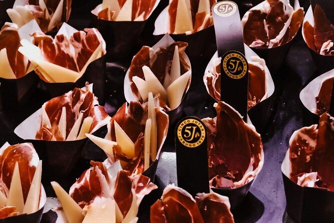 Barcelona Tapas Walking Tour: Food, Wine & History - Starting Near La Boqueria: Where You Meet and What to Expect