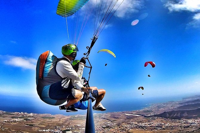 BRONZE tandem paragliding flight in South Tenerife, free pick up - La Caleta beach landing: soft sand touchdown and real ocean sound