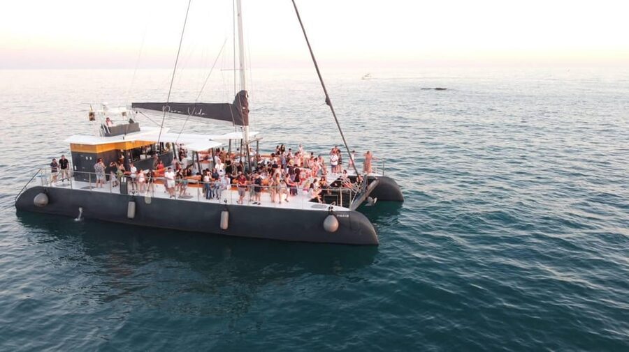 Cádiz: Sunset Catamaran Cruise Tours - Stepping Aboard the Pura Vida Catamaran Deck Experience