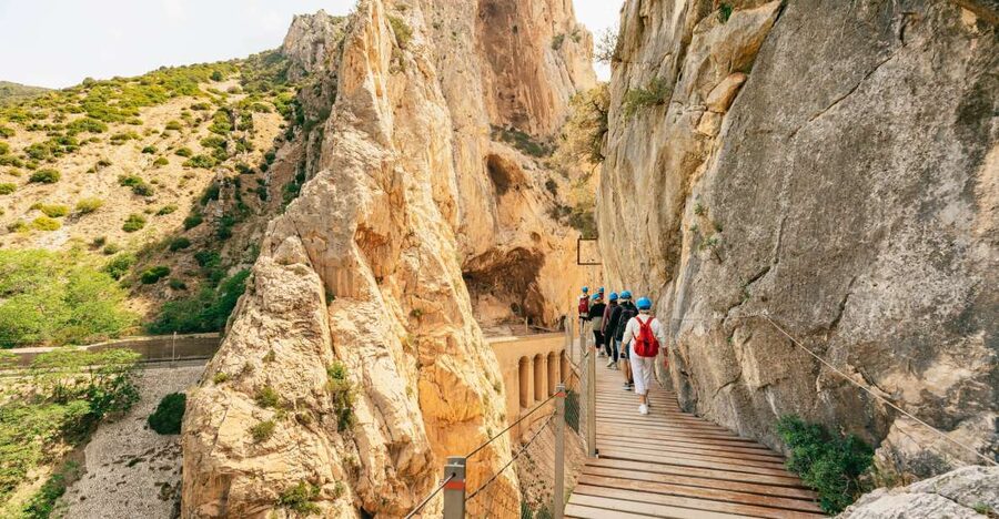 Caminito del Rey: Tickets, Guided Tour, Shuttle & Water - Start-of-walk tunnel, helmets, and the safety briefing rhythm