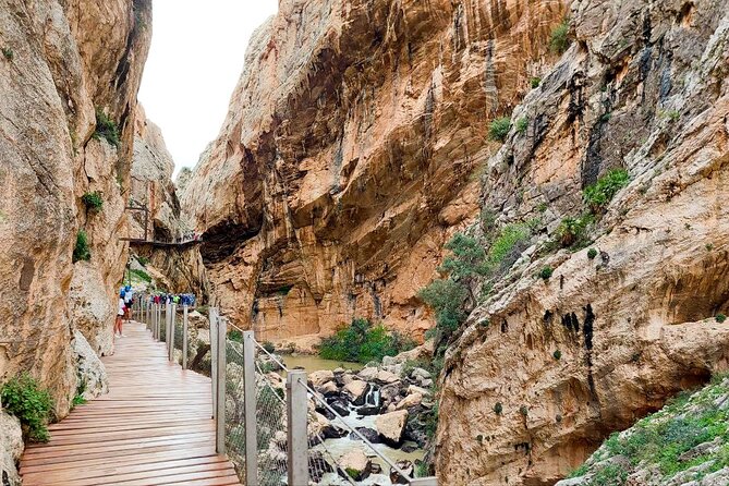 Caminito del Rey with Pickup from Malaga City - The start area: helmets, footwear rules, and the tunnel entrance