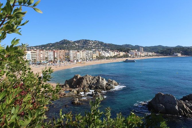 Costa Brava Day Sightseeing Tour with Boat Trip from Barcelona - Getting to Lloret de Mar: beach promenade views and Saint Roma church
