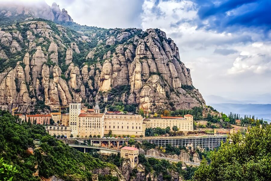 From Barcelona: Montserrat Day Trip with Optional Tickets - Inside the Montserrat Monastery tour: art, faith, and architecture cut into stone