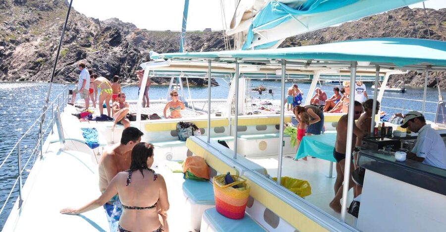 From Roses: Catamaran Cruise Cap Norfeu - Cadaqués - On Board Magic: Space, Nets, Showers, and the Bar