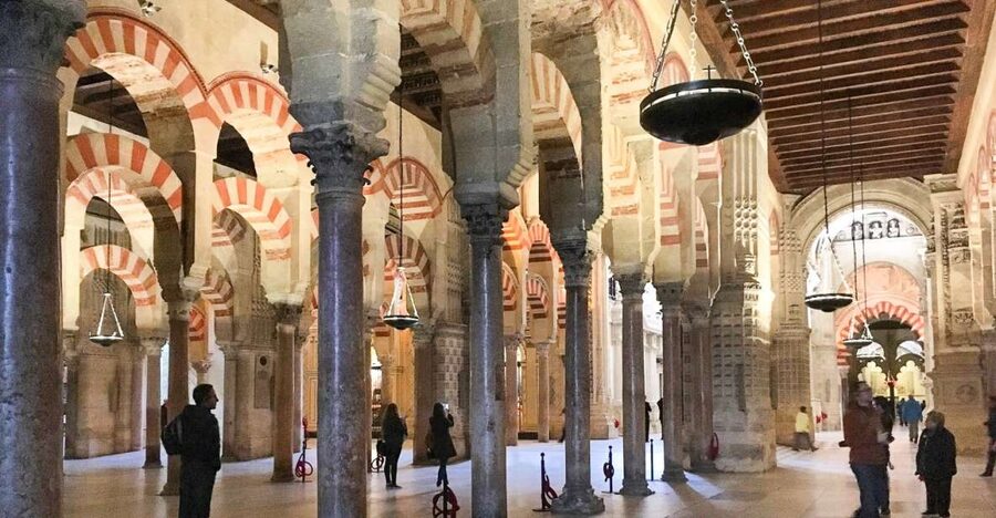 From Seville: Cordoba and Mosque Cathedral Guided Tour - Getting oriented in the Judería: narrow streets and the Calle de las Flores