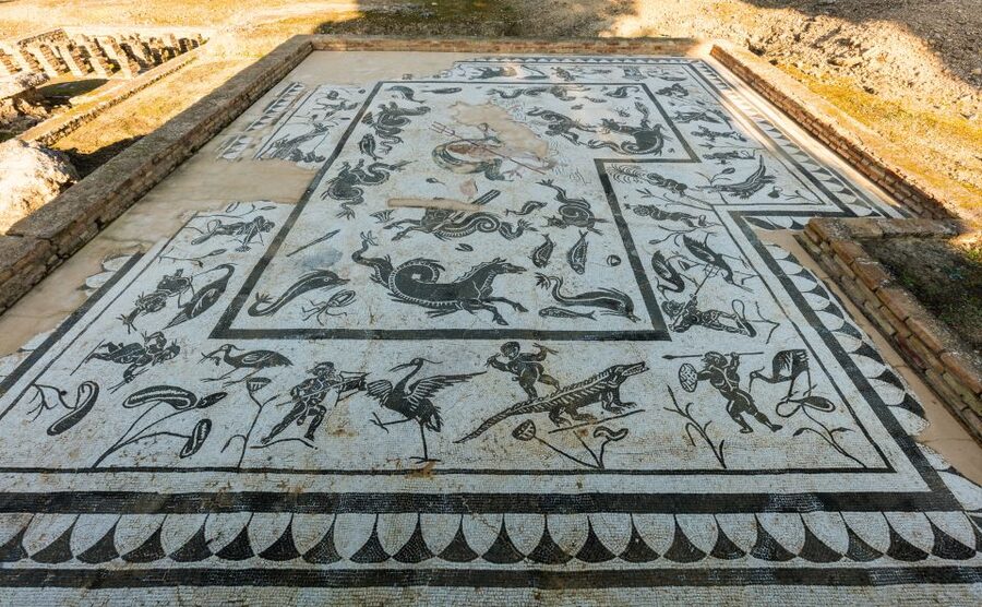 From Seville: Italica Roman City & Medieval Monastery Tour - Mosaics, underground passages, and gladiator-linked spaces