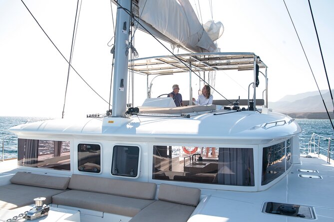 Fuerteventura: Small-Group Magic Deluxe Catamaran Cruise - Sailing the volcanic south coast near beaches