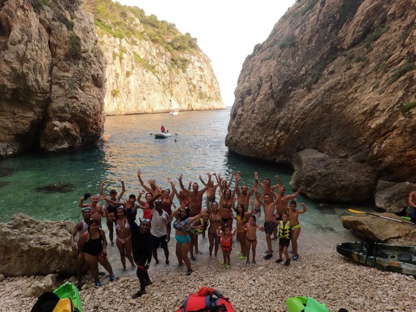 Granadella: Caló, Cova Llop Marí, and Ambolo Kayak Trip - Kayaking from Platja Granadella, where the timing matters
