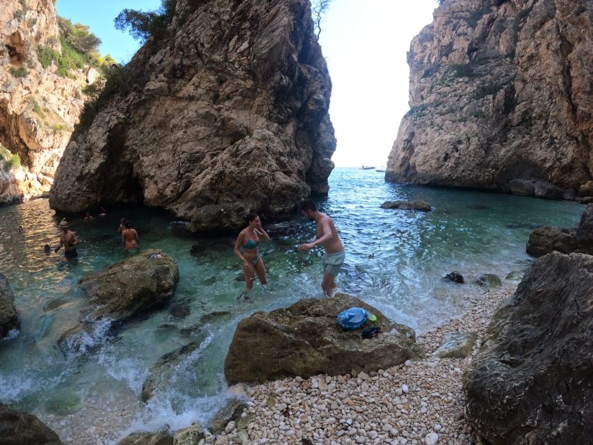 Granadella: Caló, Cova Llop Marí, and Ambolo Kayak Trip - Practical tips: water shoes, parking, and motion sickness prep