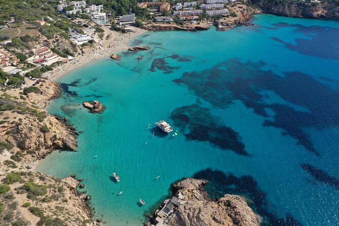 Ibiza Beach Hopping Cruise with Paddleboards, Drinks and Food 6h - Port des Torrent, Cala Salada, and Cala Tarida, Coastline Views in the Mix