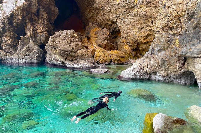 Kayak Paradise: Cala Portixol Snorkel, Cave & Cliff Jumping Tour - Isla de Portixol: hidden caves, the blue lagoon, and supervised cliff jumping