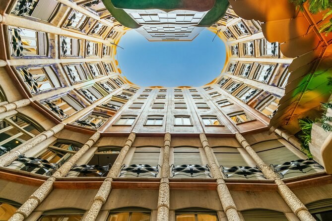 La Pedrera-Casa Mila Admission Ticket with Audioguide - Inside the building: lobbies, mosaics, and the two courtyards
