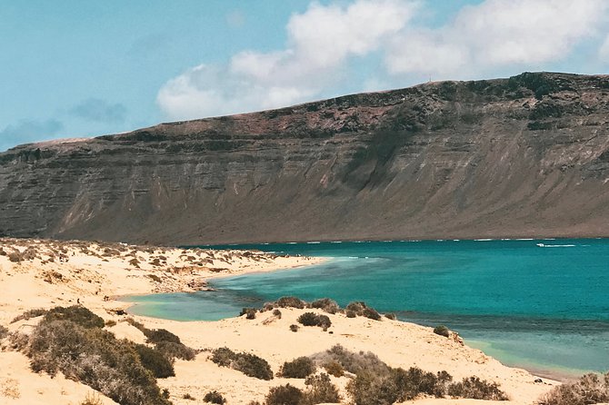 Lanzarote: La Graciosa island cruise with lunch and water activities - On-Board Vibe: Sangria, Beer, Paella, and the Music Volume