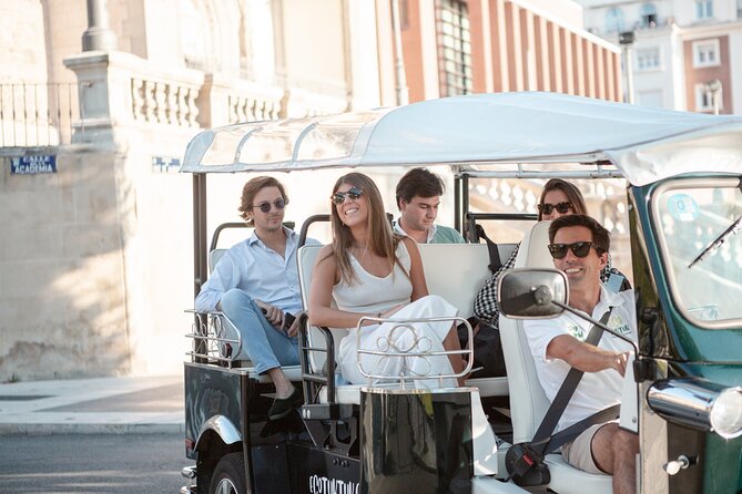 Madrid Express Tour with Local Guide in Eco Tuk Tuk Private - Cibeles and Neptune: Madrid’s sports rivalry, turned into city art