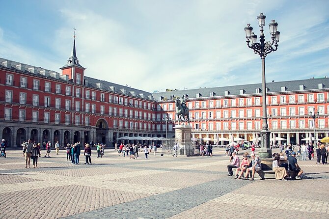Madrid Historic Centre Food Tour with Authentic Tapas & Wines - The 180-Year-Old Deli: Iberian Ham, Manchego, and Olive Oil