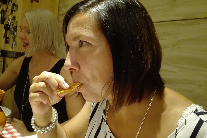 Madrid Local's Tapas Tour Dinner with a side of History - Puerta del Sol, Madrid’s 1800s Time Square and the 12 Grapes Ritual