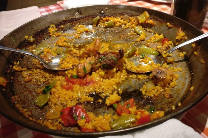 Madrid Local's Tapas Tour Dinner with a side of History - Royal Palace Border Walk: Statues, Roof Details, and Garden Stories