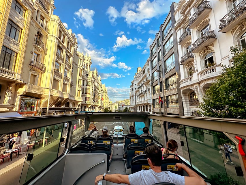 Madrid: Panoramic Open-Top Bus Day or Night Tour with Guide - Meeting Point and Timing: Catch the 20:00 Loop at Neptune Fountain