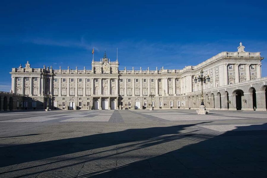 Madrid: Royal Palace Entry with Audio Guide - Ticket pickup at Plaza de España 9, and how to avoid start-day hassle