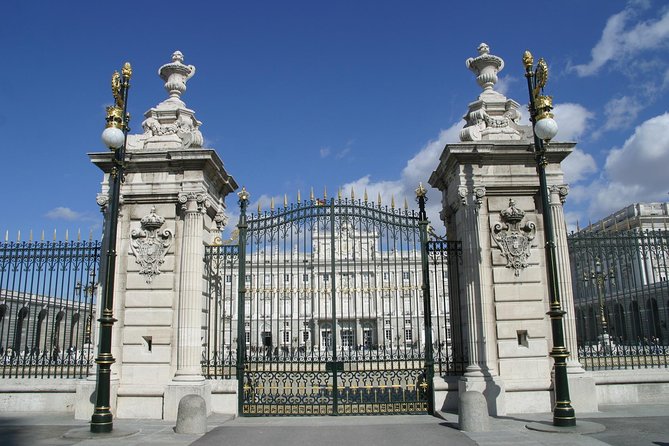 Madrid Sightseeing Tour with Royal Palace Skip the Line Ticket - Charles III to Modern Madrid: Puerta de Toledo, Gran Vía Energy, and Big Stadium Stops