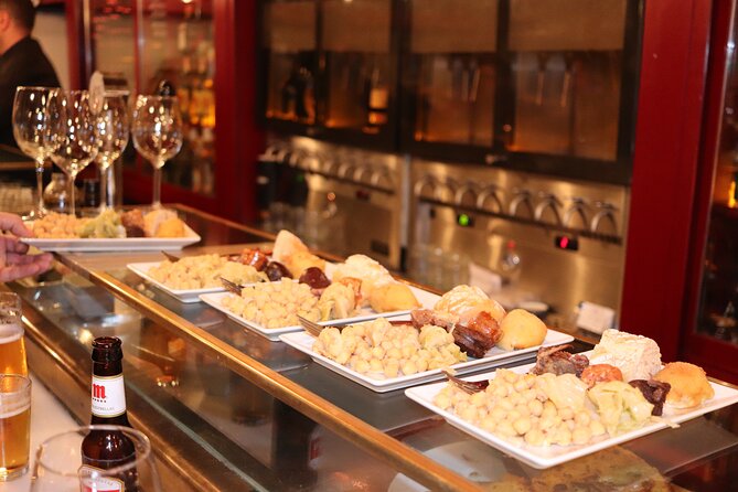 Madrid Small Group Tapas Tour at 4 Venues -Lunch or Dinner - Madrid Old City Hall Stop: Where Tapas Feels Like a Local Habit