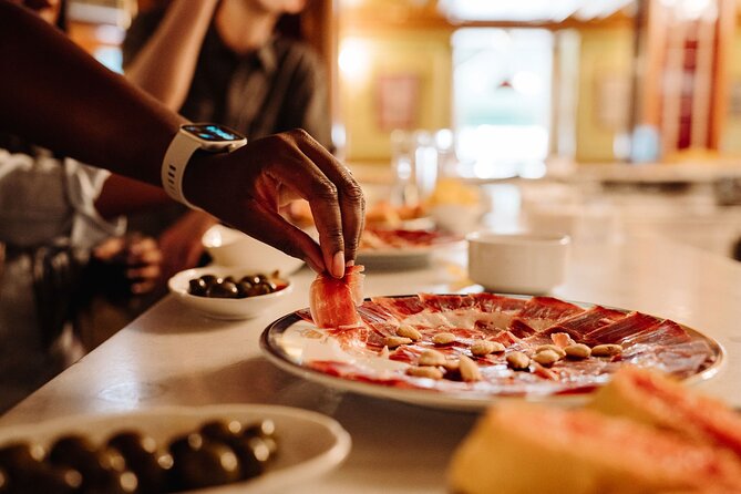 Madrid Tapas & Taverns Small Group Food & History Tour - Mesón del Champiñón: A Historic Center Tapas Bar and a Local Pairing