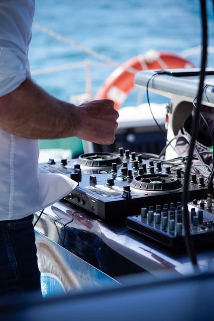Malaga: Catamaran Sailing Cruise with Swimming & Optional DJ - Optional DJ: good when it is included, unpredictable when it is not