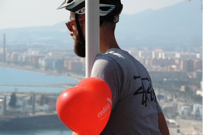 Malaga Electric Bikes Guided Tour - The city core: luxury street vibes, Cathedral stops, and Roman Theatre photos