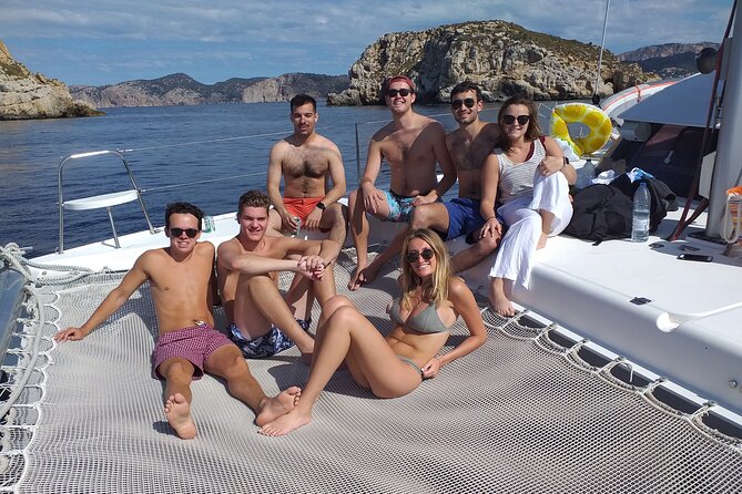 Mallorca Catamaran Small Group Cruise with Tapas 4-hours - The swim stop: snorkeling, SUP boards, and a trampoline jump