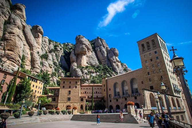Montserrat & Winery Visit Tour with Traditional Farmhouse Lunch - Montserrat Monastery: the Black Madonna, Basilica tickets, and mountain paths