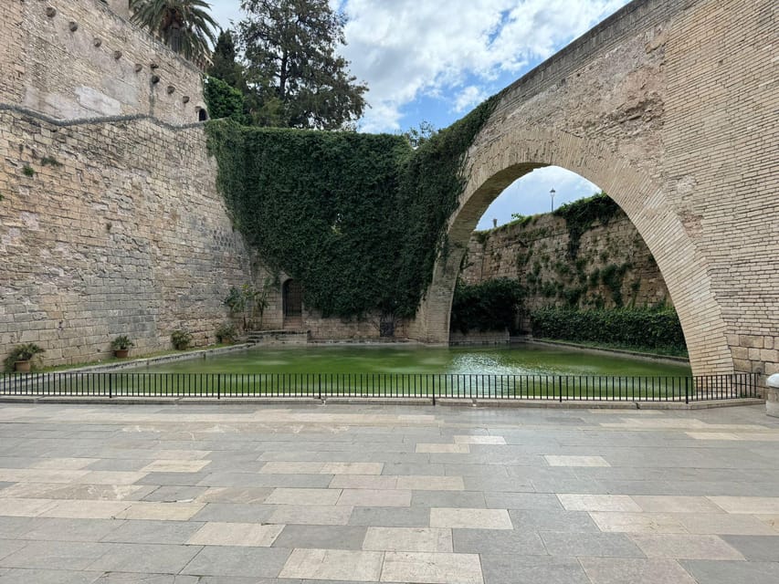 Palma de Mallorca Old Town Guided Bike Tour (Small Groups) - Palma Cathedral and La Almudaina: the big façade moment