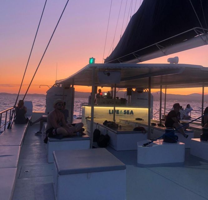 S'Arenal: Sunset Catamaran Cruise with BBQ - Anchored Swim Time: Jump In, Sunbathe, Repeat