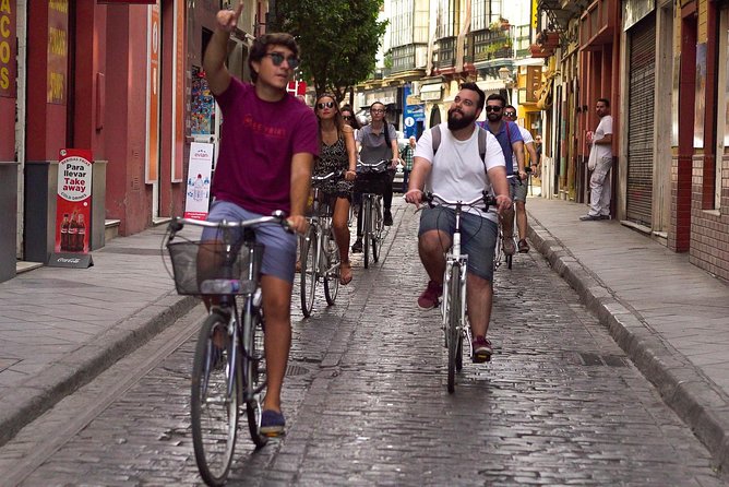 Seville Highlights Bike Tour (English) - Triana and Torre del Oro: port power, pottery, and flamenco culture