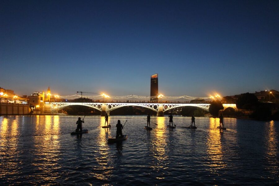 Seville: Sunset and Evening Paddle Boarding Tour - Torre del Oro: A Stop Where the Board Becomes Part of the Sightseeing